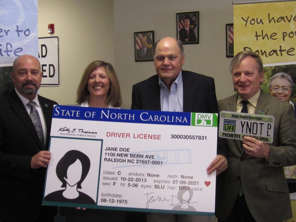 Group stands inside NC DMV