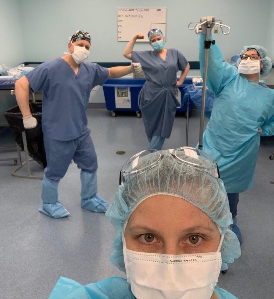 Medical team in scrubs pose