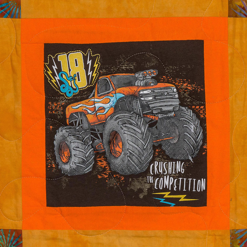 Quilt square for CJ Adams with a large monster truck, the number 18, and text reading: crushing the competition
