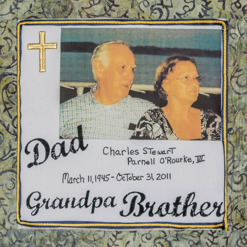 Quilt square for Charles O’Rourke 3rd with photo of Charles with family, a cross, and text reading Dad, Grandpa, Brother.