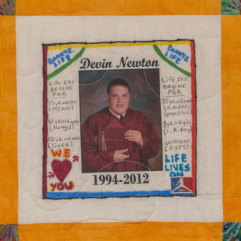 Quilt square for Dein Newton with a graduation photo of Devin and handwritten notes on the side.