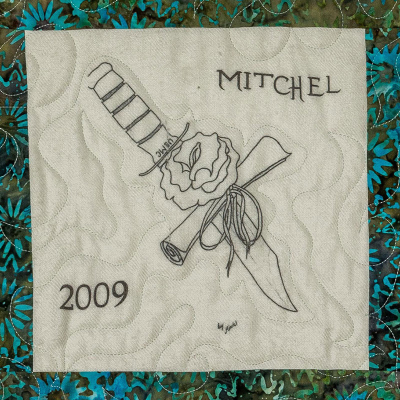 Quilt square for Mitchell Gibbs with an outline of a knife, rose, and text USMC.