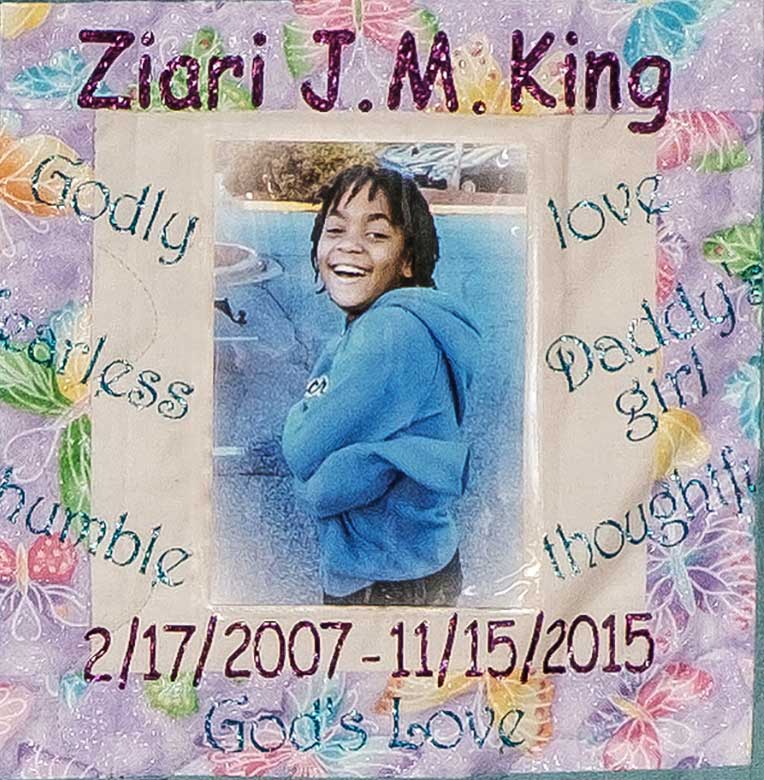 Quilt square for Ziari King with a photo of Ziari at the center with text on the sides reading: love, daddy’s girl, thoughtful, humble, fearless, Godly.