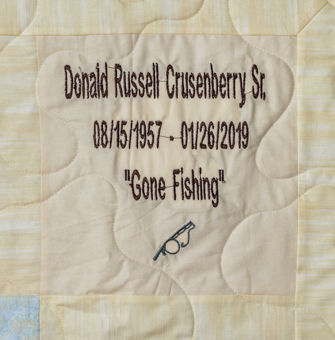 Quilt square for Donald Crusenberry with a patch of a fishing rod and text reading: Gone Fishing