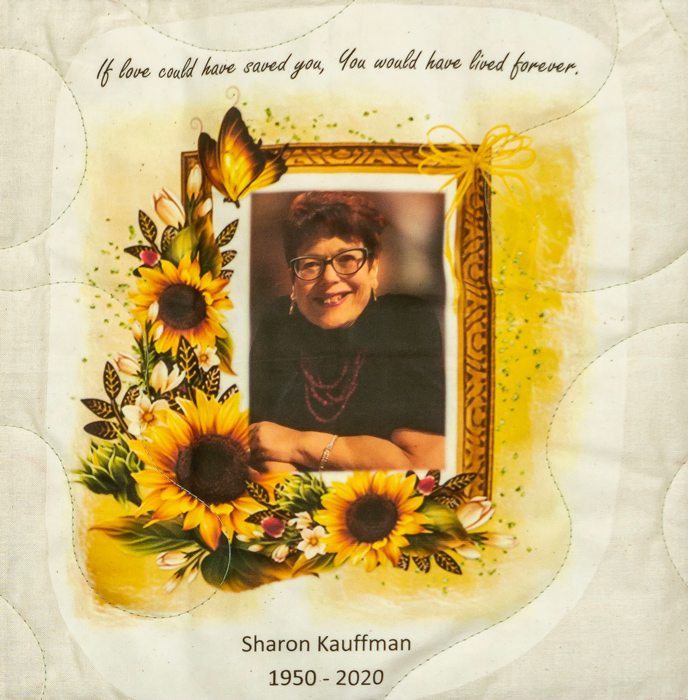 Quilt square for Sharon Kauffman with Portrait photo of Sharon surrounded by sunflowers