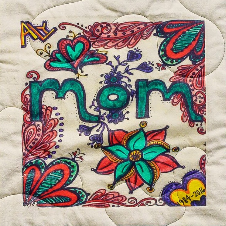 Quilt square for Alyson Hennessee with flowers and text reading: Aly and Mom.