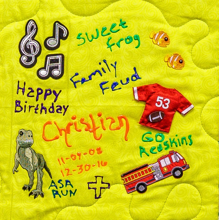 Quilt square for Christian Proctor with patches of music, dinosaurs, a sports jersey, firetruck, and cross. Text reading: sweet frog, family feud, happy birthday, asa run.