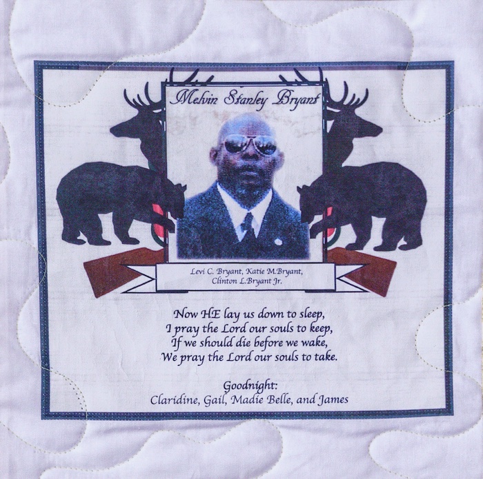 Quilt square for Melvin Bryant with photo of Melvin in a suite overlaying deer and bears. Text reading: Now he lay us down to sleep. I pray the Lord our souls to keep, If we should die before we wake, We pray the Lord our souls to take. Goodnight: Claridine, Gail, Madie Belle, and James