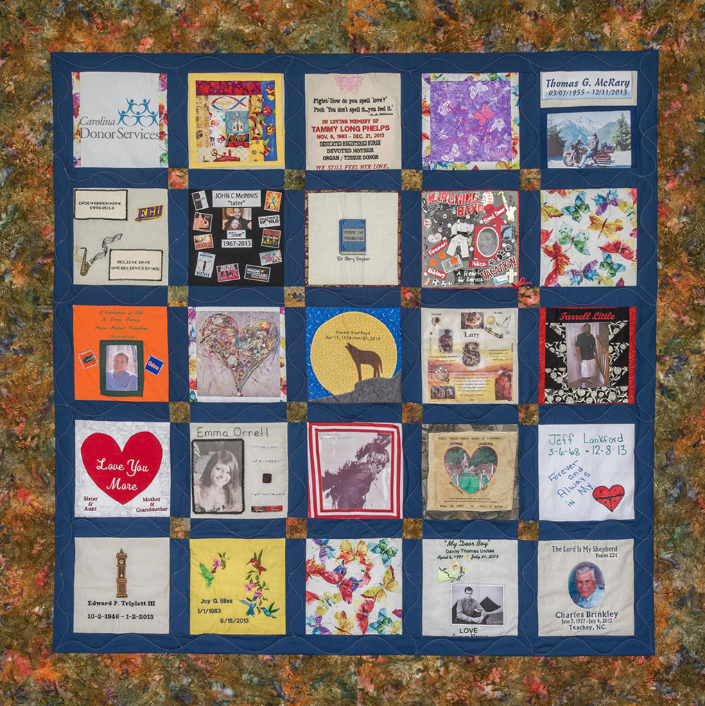 Colorful blue quilt with leaf pattern and 25 unique squares featuring donor names, photos, and memories