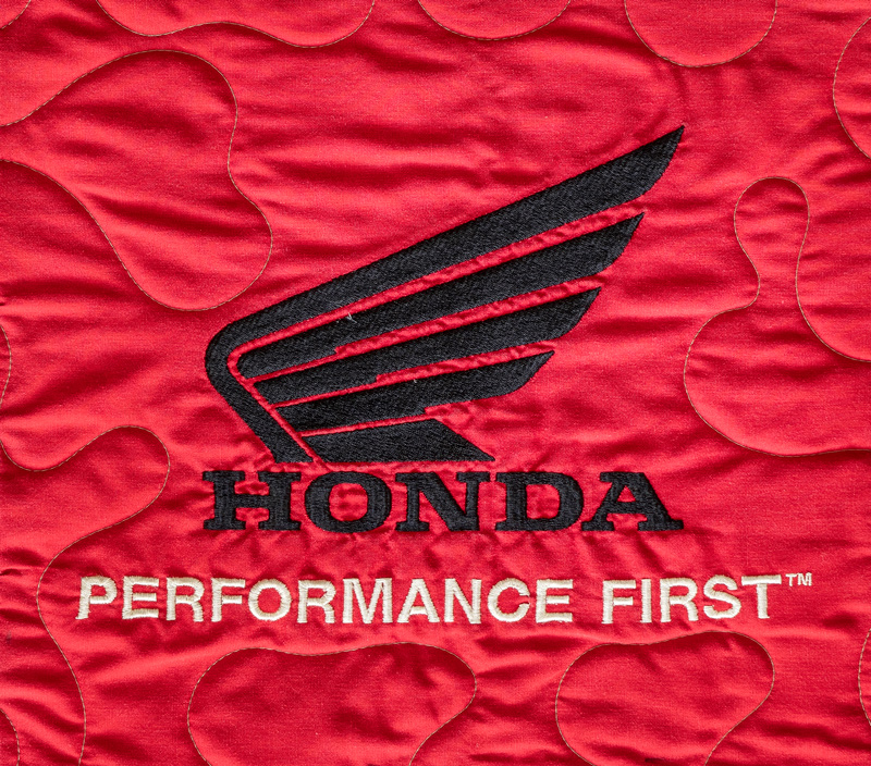 Quilt Square for Carl Philips with Honda Logo and text reading performance first