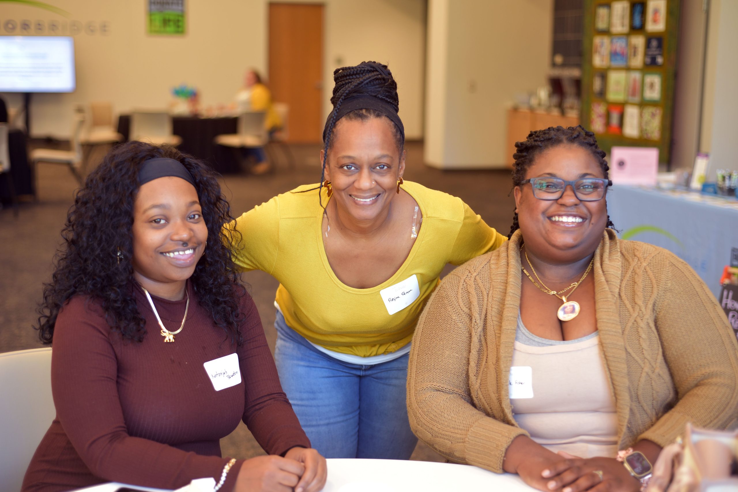 Three women smiling at camera