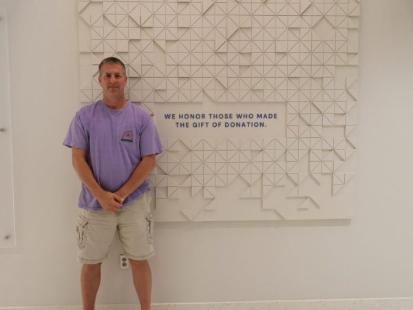 man in front of wall