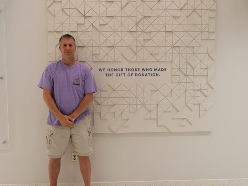 man in front of wall