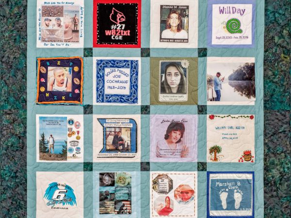 Colorful Green and teal quilt with 16 unique squares featuring donor names, photos, and memories