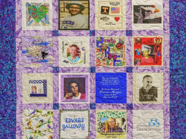 Colorful purple and pink quilt with 16 unique squares featuring donor names, photos, and memories
