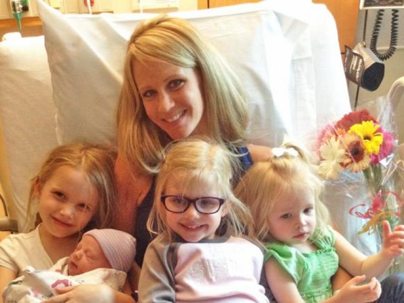 Tissue recipient Kacy in a hospital bed with her kids