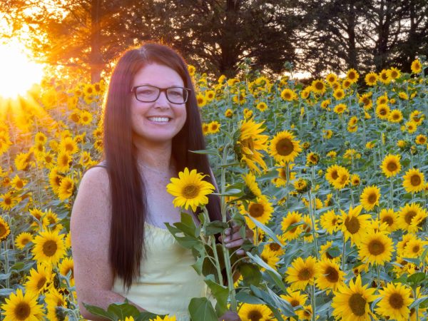 Woman in sunflower field