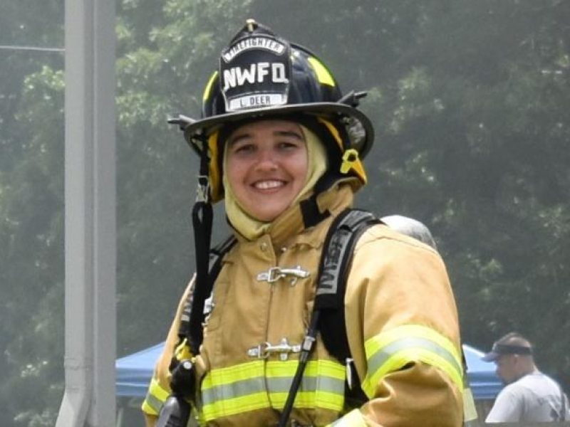 Organ recipient Lauren in a firefighter uniform