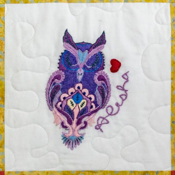 Quilt square for Alesha Staton with an illustration of an owl and a heart.