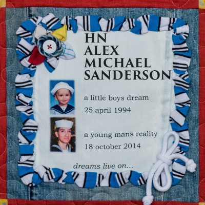 Quilt square for Alex Sanderson with photos of Alex in a sailor’s uniform as a child and as an adult sailor in the navy. Text reading: A little boys dream 25 April 1994. A young man’s reality 18 October 2014. Dreams live on