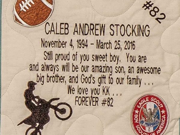 Quilt square for Caleb Andrew Stocking with patches of a football, the #82, a motorcycle, and an eagle scout badge. Text reading: Still proud of you sweet boy. You are and always will be our amazing son, an awesome big brother, and God’s gift to our family. We love you kk. Forever #82
