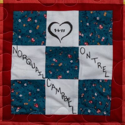 Quilt square for Norquail Campbell with single heart and a flower pattern