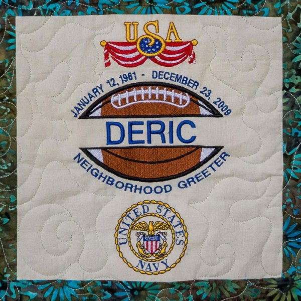 Quilt square for Deric Suddith with USA and Navy Logos, and text reading: neighborhood greeter.