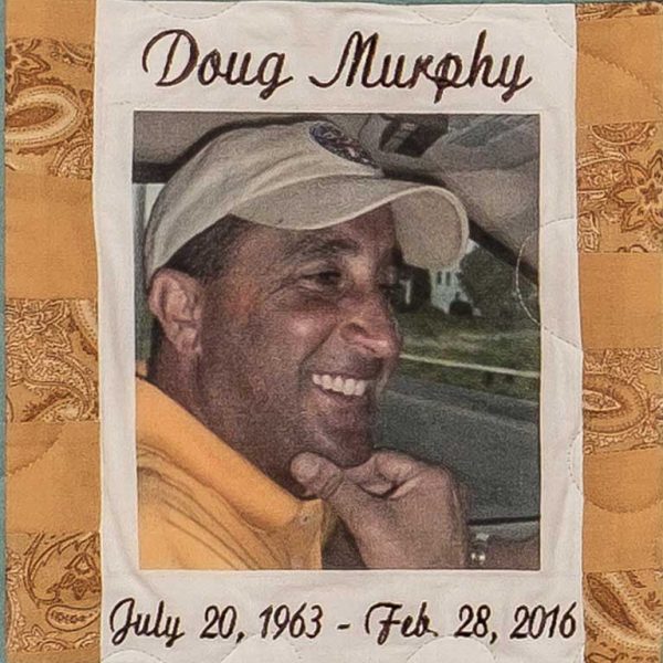 Quilt square for Douglas Murphy with a photo of Douglass in the center.