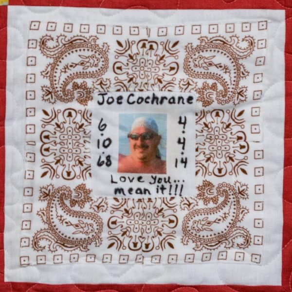 Quilt square for Joe Cochrane with photo of Joe at the center and text reading: Love you. Mean it!