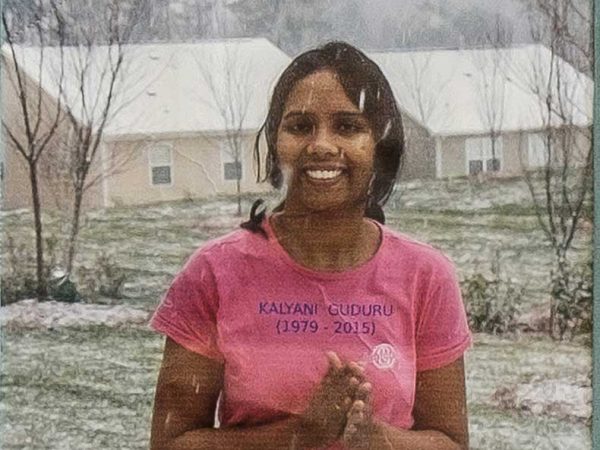 Quilt square for Kalyani Guduru with a photo of Kalyani standing in a snow storm.