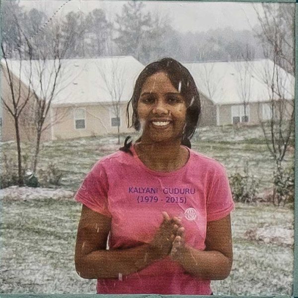 Quilt square for Kalyani Guduru with a photo of Kalyani standing in a snow storm.