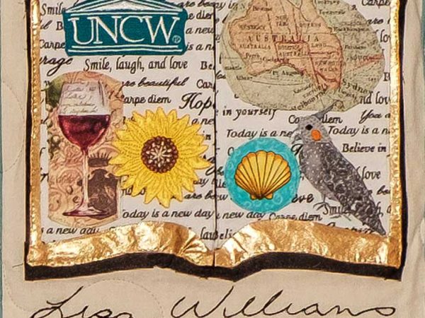 Quilt square for Lisa Williams with an illustration of a book with patches of wine, UNCW logo, a map of Australia, a shell, flower, and bird.