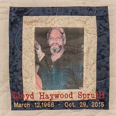 Quilt square for Lloyd Haywood Spruill with a photo of Lloyd at the center