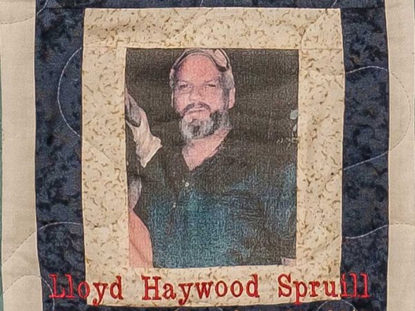 Quilt square for Lloyd Haywood Spruill with a photo of Lloyd at the center