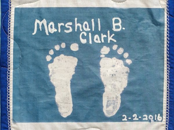 Quilt square for Marshall B. Clark with baby feet imprint.