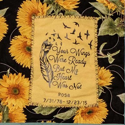 Quilt square for Rosa Cwalina with sunflowers and text reading: Your wings were ready but my heart was not.