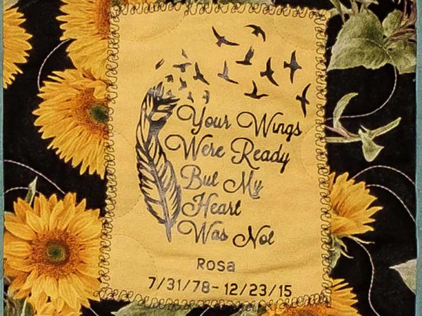 Quilt square for Rosa Cwalina with sunflowers and text reading: Your wings were ready but my heart was not.