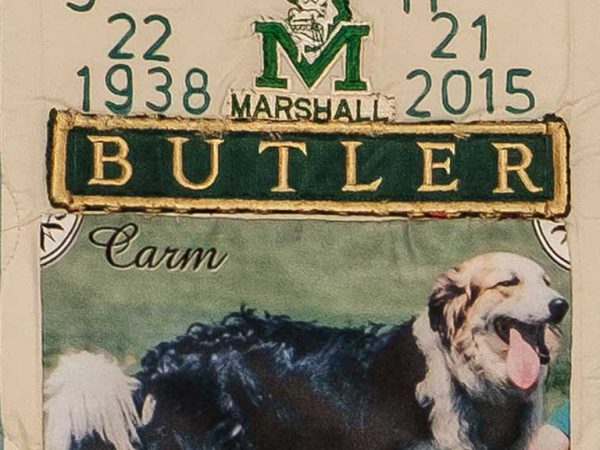Quilt square for Shirrell Butler with a logo for M Marshall Butler and a photo of a dog.