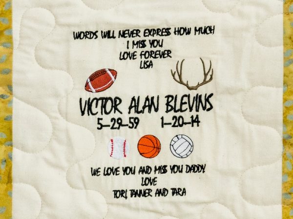 Quilt square for Victor Alan Blevins with sport patches and text reading: Words will never express how much I miss you. Love forever Lisa. We love you and miss you daddy. Love Tori, Tanner, and Tara.