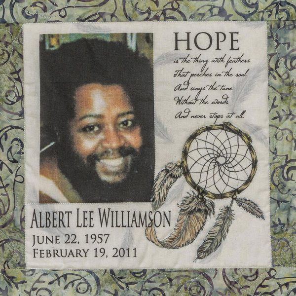 Quilt square for Albert Williamson with a portrait of Albert and text reading: Hope is the thing with feathers that perches in the soul and sings the tune without the words and never stops at all.