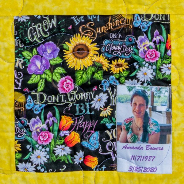 Quilt square for Amanda Browers with photo of Amanda and colorful flowers
