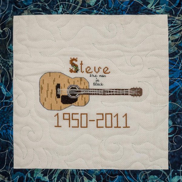 Quilt square for Anthony Steve Jordan with patch of guitar.