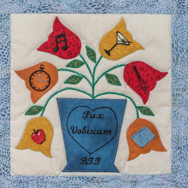 Quilt square for Benjamin Terrell with a plant and leaves with symbols of an apple, clock, music note, martini, whisk, and book.