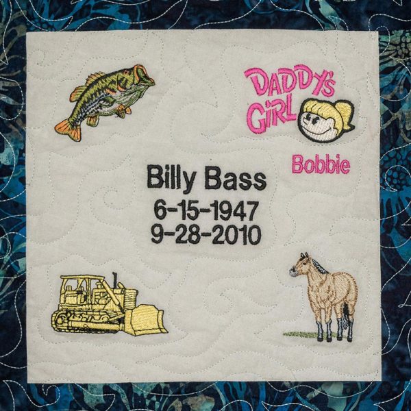 Quilt square for Billy Bass with a fish, tractor, horse, and text reading Daddy’s girl Bobbie.