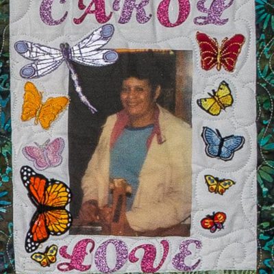Quilt square for Carol Avery with a photo of Carol and a butterfly pattern.