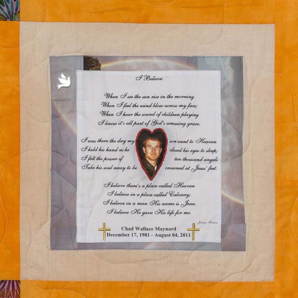 Quilt square for Chad Maynard with a photo of Chad at the center of a heart, a poem, rainbows, a dove, and crosses in the background.