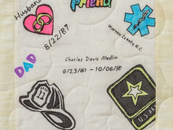 Quilt square for Charles Medlin with patches of Friend, Heart and Rings, Dad, Firefighter Hat, US Army