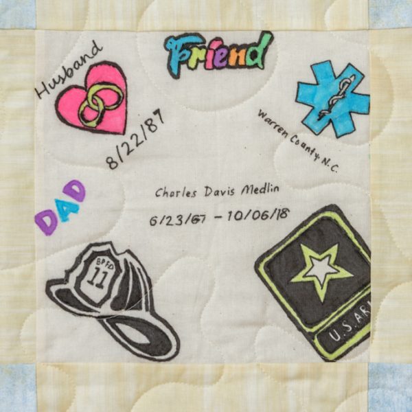 Quilt square for Charles Medlin with patches of Friend, Heart and Rings, Dad, Firefighter Hat, US Army