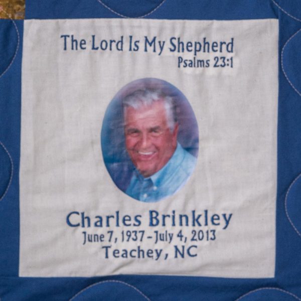 Quilt square for Charles Brinkley with portrait of Charles and text reading: The Lord is my shepherd. Psalms 23:1