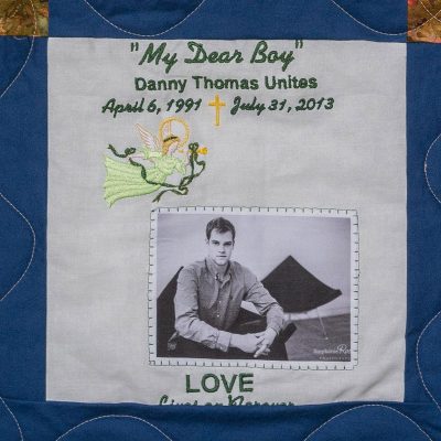Quilt square for Daniel Unites with outdoor portrait of Daniel and text reading: My Dear Boy.